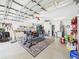 Spacious garage featuring ample storage, exercise equipment, and overhead lighting at 4207 Bair Ave, Fruitland Park, FL 34731