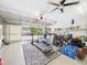 Organized garage space with exercise equipment, storage solutions, and an open garage door at 4207 Bair Ave, Fruitland Park, FL 34731