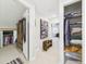 Hallway featuring entry to walk-in closets and bedroom with an open doorway at 4207 Bair Ave, Fruitland Park, FL 34731