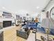 Open living space featuring a brick fireplace, hardwood floors, and stylish decor at 4207 Bair Ave, Fruitland Park, FL 34731