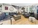 Spacious living room with comfortable seating, a large window, and modern accents at 4207 Bair Ave, Fruitland Park, FL 34731