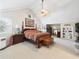 Spacious main bedroom featuring a vaulted ceiling, ceiling fan, and windows at 4207 Bair Ave, Fruitland Park, FL 34731