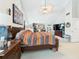 Bright main bedroom with vaulted ceiling, ceiling fan, tv, and furnishings at 4207 Bair Ave, Fruitland Park, FL 34731