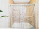 Shower featuring neutral toned tile surround and glass doors at 4207 Bair Ave, Fruitland Park, FL 34731