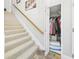 Carpeted staircase leading to the upper level, with closet at 4207 Bair Ave, Fruitland Park, FL 34731