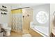 Bright bathroom with shower, tub, and tile flooring, creating a clean and functional space at 4401 Abaco Dr, Tavares, FL 32778