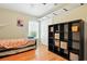 Bright bedroom with hardwood floors, storage shelf and trundle bed at 4401 Abaco Dr, Tavares, FL 32778