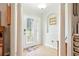 Inviting foyer featuring tile flooring, white columns, and a decorative glass front door at 4401 Abaco Dr, Tavares, FL 32778
