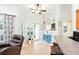 Open floor plan living room with ceiling fan, lots of decorations, and plenty of room to relax at 4401 Abaco Dr, Tavares, FL 32778