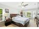 Bright main bedroom with bay window and large dresser at 4401 Abaco Dr, Tavares, FL 32778