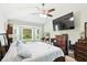 Main bedroom suite with a view and television screen at 4401 Abaco Dr, Tavares, FL 32778