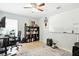 Bright home office featuring a desk, shelving, and natural light from the window at 4401 Abaco Dr, Tavares, FL 32778