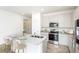Modern, updated kitchen features a center island with seating, granite countertops, and stainless steel appliances at 5002 Abigail Dr, Lake Wales, FL 33859
