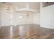 Bright living room boasting hardwood floors and plenty of natural light at 5005 County Road 125B1, Wildwood, FL 34785
