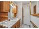 Functional bathroom featuring vanity, tile, and mirror at 550 Floral Dr, Kissimmee, FL 34743