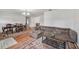 Spacious living room area featuring hardwood flooring, neutral paint, and dining space at 550 Floral Dr, Kissimmee, FL 34743