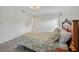 Comfortable main bedroom showcasing a large bed and bedside table at 550 Floral Dr, Kissimmee, FL 34743