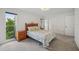 Spacious main bedroom featuring a large window and closet at 550 Floral Dr, Kissimmee, FL 34743