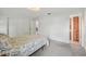 Bright main bedroom with closet and doorway to bathroom and dining area at 550 Floral Dr, Kissimmee, FL 34743