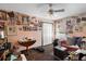Whimsical bedroom decorated with colorful pictures and decorations covering the walls, plus wood floors at 6001 Pine Bluff Ln, Mascotte, FL 34753