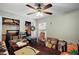 Bedroom filled with various items, including furniture, boxes, and decor, plus a window and closet at 6001 Pine Bluff Ln, Mascotte, FL 34753
