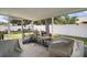 Enclosed patio featuring lush greenery and comfortable seating, perfect for outdoor relaxation at 6001 Pine Bluff Ln, Mascotte, FL 34753