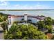 Aerial view showcasing the property's prime location and stunning waterfront backdrop at 601 N Mcdonald St # 2, Mount Dora, FL 32757