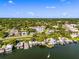 Sweeping aerial view capturing the condo building amid a lush landscape, next to picturesque waterfront properties and a lake at 601 N Mcdonald St # 2, Mount Dora, FL 32757