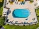 Overhead view of the community pool and outdoor seating, perfect for relaxing and socializing at 601 N Mcdonald St # 2, Mount Dora, FL 32757