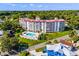 Aerial view displaying the complex, pool area, and meticulously maintained landscaping at 601 N Mcdonald St # 2, Mount Dora, FL 32757