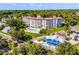 Aerial view revealing the building’s architecture, pool area, and attractive landscaping at 601 N Mcdonald St # 2, Mount Dora, FL 32757