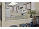Functional kitchen with white appliances, ample counter space, and dark wood-trimmed cabinetry at 601 N Mcdonald St # 2, Mount Dora, FL 32757