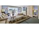 Cozy living room area with balcony access and comfortable seating. Well lit room with a bright open space at 601 N Mcdonald St # 2, Mount Dora, FL 32757