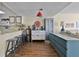 Open-concept living area with a bar, kitchen view, and comfortable seating at 601 N Mcdonald St # 2, Mount Dora, FL 32757
