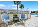 Outdoor patio area featuring two outdoor chairs and a view of the community pool at 601 N Mcdonald St # 2, Mount Dora, FL 32757