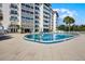 Inviting swimming pool surrounded by a spacious deck and comfortable lounge chairs at 601 N Mcdonald St # 2, Mount Dora, FL 32757