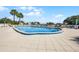 Community swimming pool offering a relaxing outdoor space with plenty of seating at 601 N Mcdonald St # 2, Mount Dora, FL 32757