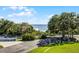 Scenic water view with lush greenery, clear blue skies, and well-manicured landscaping at 601 N Mcdonald St # 2, Mount Dora, FL 32757