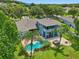 Outdoor living at its finest with a pool, hot tub, and a multi-level patio area at 6048 Tremayne Dr, Mount Dora, FL 32757