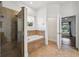 Bathroom features a glass enclosed shower and a separate tub beneath a window at 6048 Tremayne Dr, Mount Dora, FL 32757