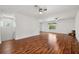 Large bonus room with windows, ceiling fans, and wood flooring at 6048 Tremayne Dr, Mount Dora, FL 32757