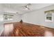 Spacious bonus room featuring wood floors, neutral walls and windows at 6048 Tremayne Dr, Mount Dora, FL 32757
