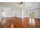 Light bonus room featuring French doors, ceiling fans, and wood floors at 6048 Tremayne Dr, Mount Dora, FL 32757