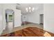 Spacious dining area with a modern chandelier flows into other living spaces at 6048 Tremayne Dr, Mount Dora, FL 32757