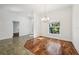 Dining room with a chandelier and view of the front yard provides a bright space at 6048 Tremayne Dr, Mount Dora, FL 32757