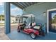 A red golf cart sits next to a door and outside wall of the house at 6048 Tremayne Dr, Mount Dora, FL 32757