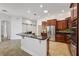 The kitchen features stainless steel appliances, granite countertops, and a breakfast bar at 6048 Tremayne Dr, Mount Dora, FL 32757