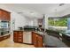 Kitchen island with stainless steel sink and granite countertops at 6048 Tremayne Dr, Mount Dora, FL 32757