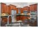 Kitchen with stainless steel appliances and custom cabinetry at 6048 Tremayne Dr, Mount Dora, FL 32757