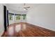 Bright and airy main bedroom with hardwood floors and ample natural light at 6048 Tremayne Dr, Mount Dora, FL 32757